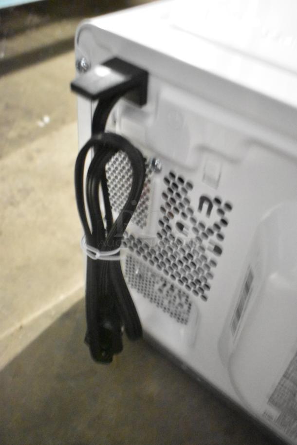 Rear view of MS8436127995-03 countertop microwave oven showing power cord and vent. Suitable for 120V, 1 phase.