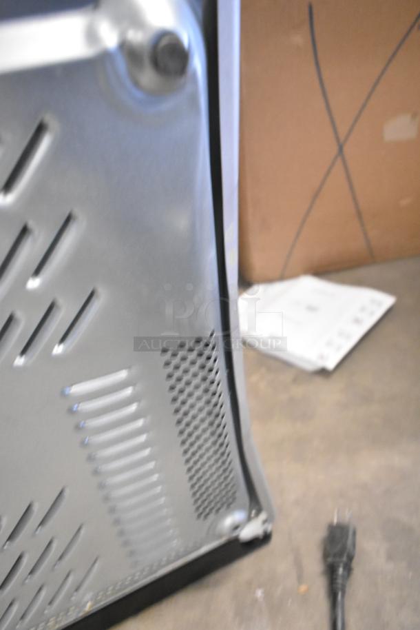 2023 Panasonic NN-SN975S stainless steel microwave, 120V, shown from rear with power cord. Model NN-SN975S.