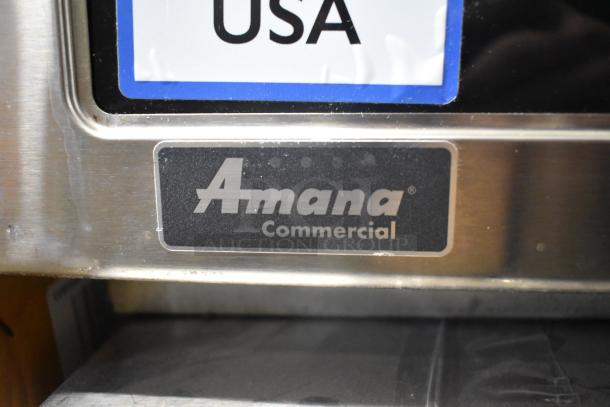 2021 Amana RCS10TS stainless steel commercial countertop microwave with logo and "Amana Commercial" label visible.