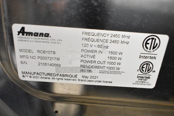 2021 Amana RCS10TS Commercial Microwave, stainless steel, 120V, 1000W, with label showing model and certification details.