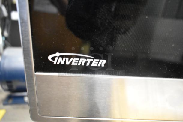 Panasonic stainless steel countertop microwave oven, 120 volts, inverter technology, black display panel, excellent condition.