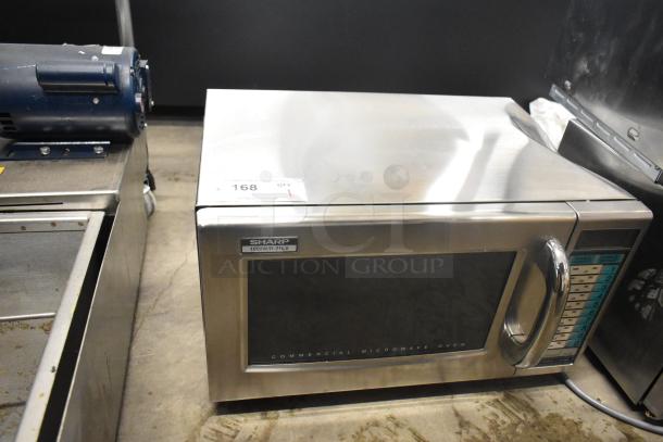 Sharp R-21LVF commercial countertop microwave oven, stainless steel, 2024 model, 120 volts, good condition, with control panel.