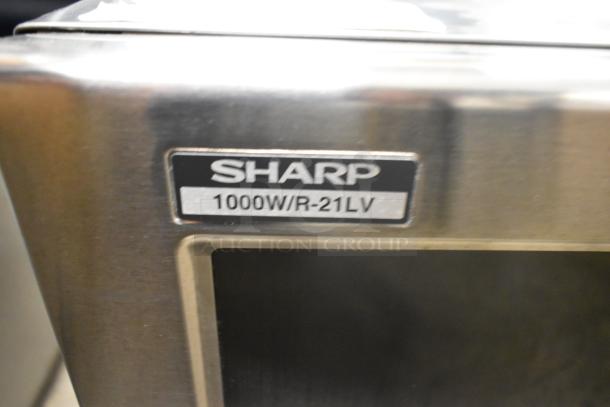 Sharp R-21LVF stainless steel commercial microwave oven, 120 volts, 1 phase, brand label visible, mint condition.