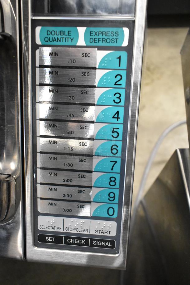 Sharp R-21LVF commercial microwave control panel with numeric keypad, timer options, and buttons labeled "Selectatime," "Stop/Clear," "Start."
