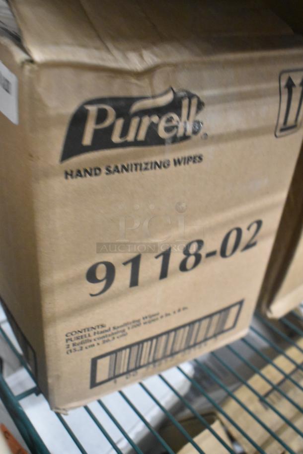Cardboard box of Purell 9118-02 Hand Sanitizing Wipes, new, with visible barcode and minor dents.