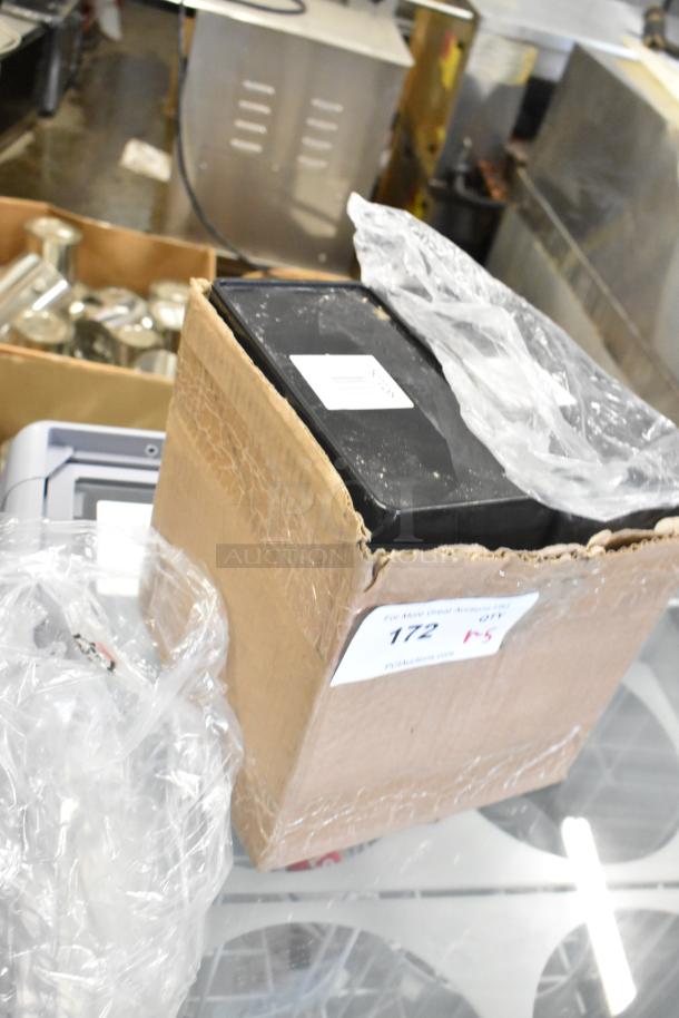 Cardboard box with packing material and items inside, marked "172," containing 5 new scratch and dent items including Purell 9118-02.