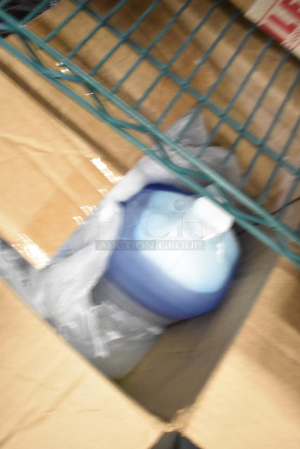 Box containing 5 new scratch and dent items, including Purell 9118-02 Hand Sanitizing Wash, Scott 91565 Cleanser.