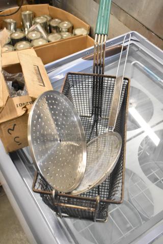 Metal fry basket with skimmer and can liners, includes multiple items. Bidding is 11 times your offer.