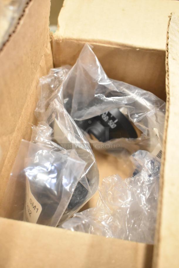 11 assorted items in box, including metal fry basket and skimmer. Visible can liners, labeled "GM1 32." New condition.