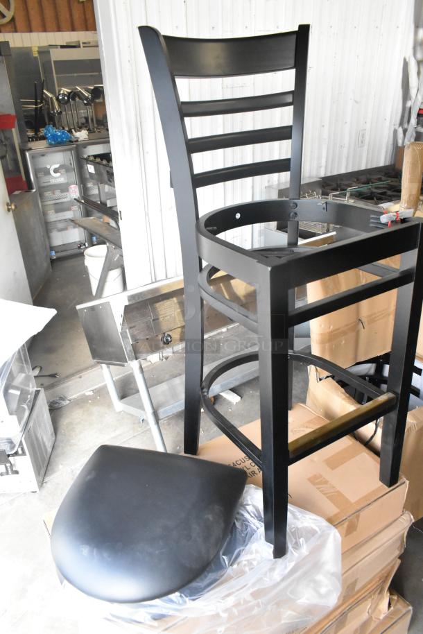 Black bar height chair, wood pattern, new with minor scratches. Includes separate black seat cushion. 40 available.