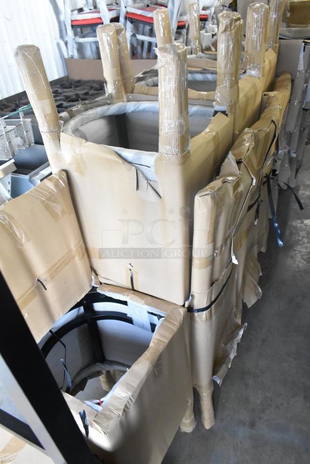 40 brand new bar height chairs with black wood pattern, black seat cushions, packaged for shipping. Scratch and dent condition.