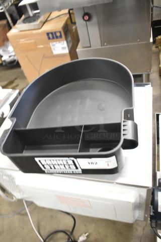 Banner Stakes Black Unit, brand new with minor scratches and dents. Features compartmentalized design, logo visible.