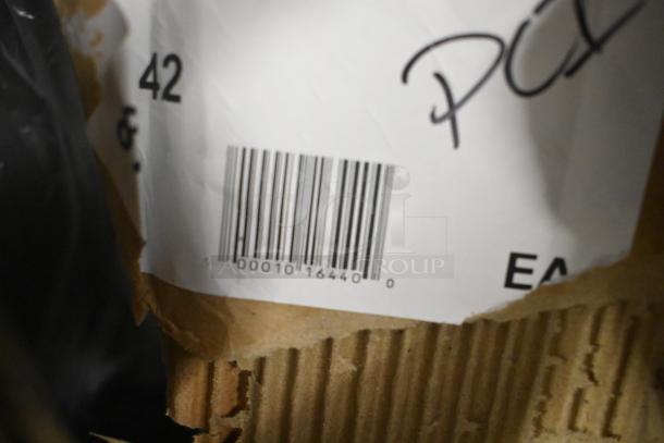 Cardboard box with a shipping label showing a barcode. Packaging appears slightly torn.
