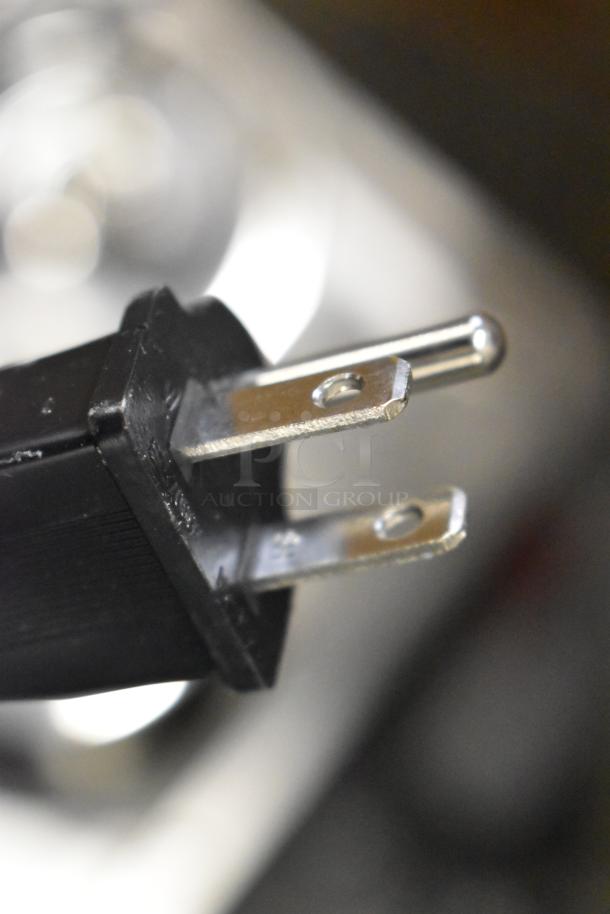 Close-up of an electrical plug for Avantco 177W50 Stainless Steel Commercial Food Warmer, scratch and dent condition, 120V.