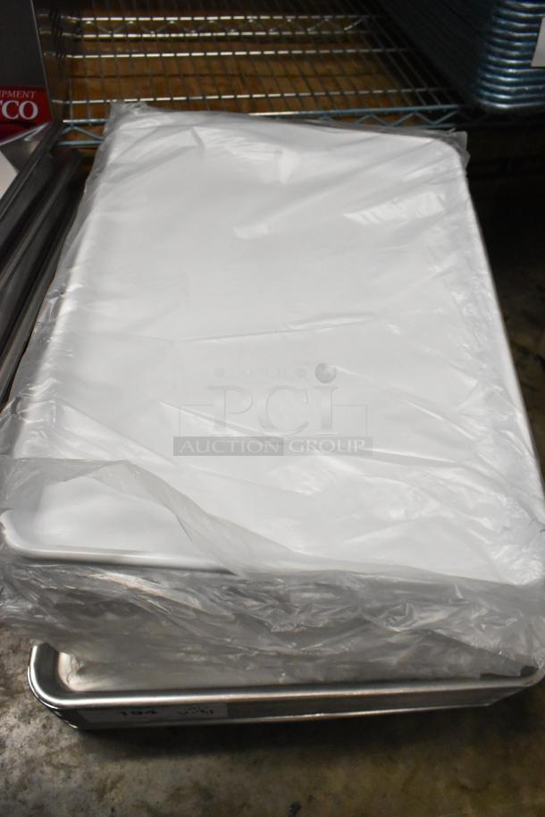 31 brand new Vollrath Super Pan V® 2/3 size stainless steel anti-jam pans, 2.5" deep, 22 gauge, in packaging.