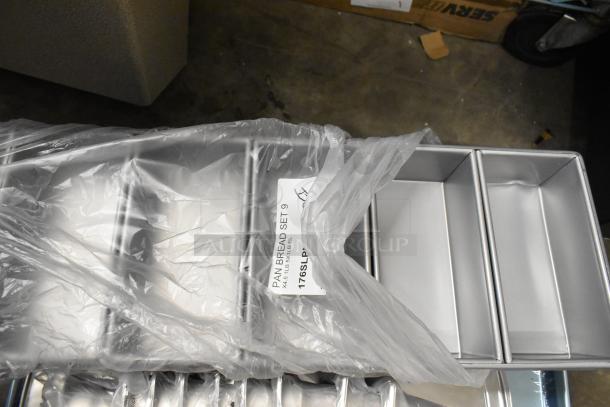 Brand new Baker's Lane 1 lb. 5-Strap Glazed Aluminized Steel Bread Loaf Pans, 9" x 4 1/2" x 2 3/4", in plastic wrap.