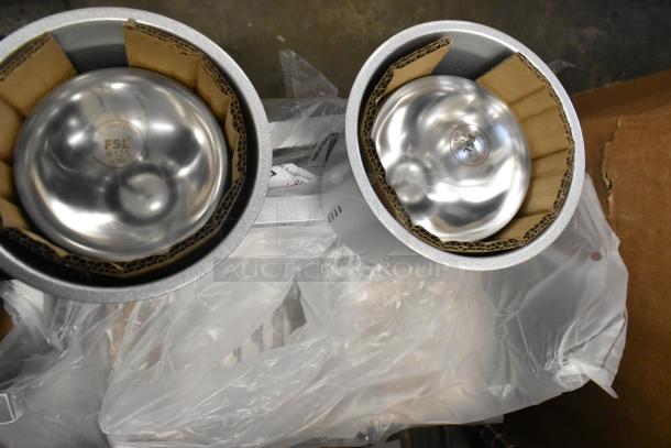 Brand new Avantco 177W62 heat lamp with two red bulbs, pan, and grate. Free-standing. Scratch and dent condition. 120V, 1 phase.