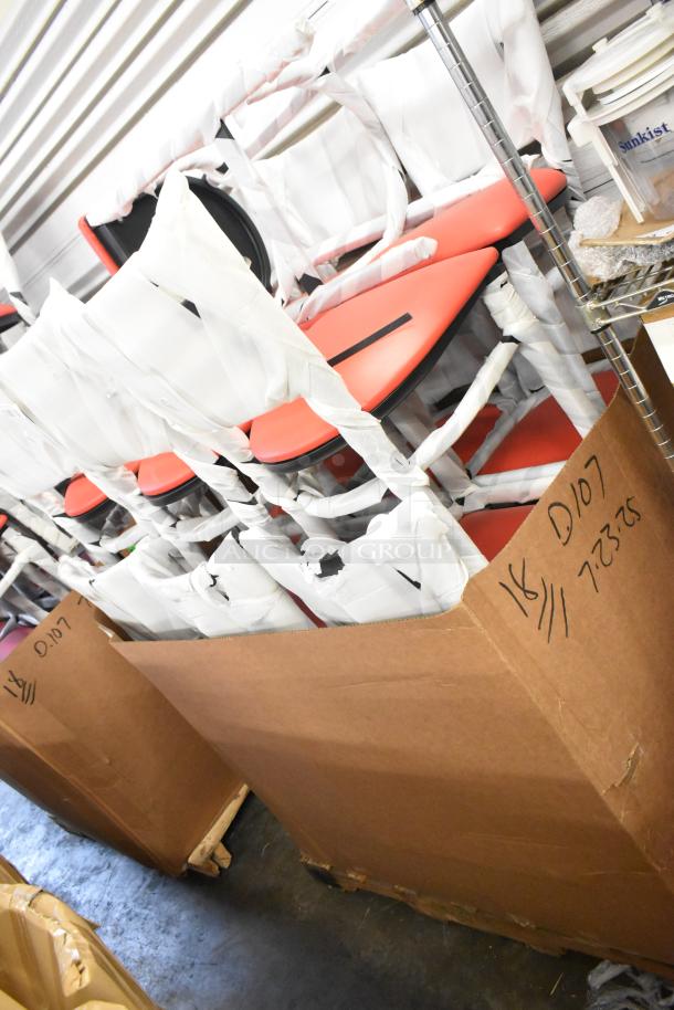 13 new black bar-height chairs with red cushions in packaging, labeled as scratch and dent, multiple in a box.