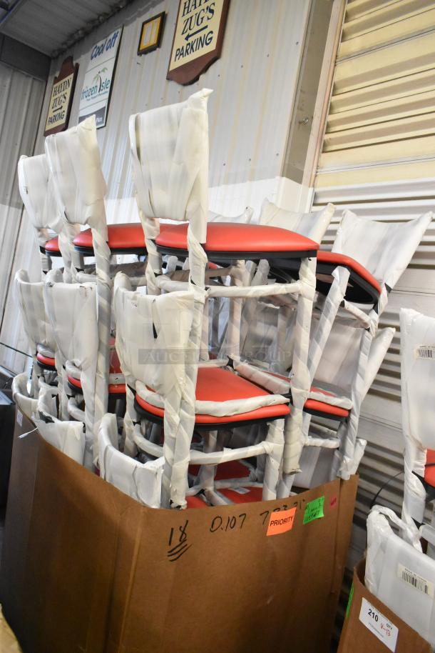 18 brand new Lancaster Table & Seating 164BMTLADFR bar height chairs, black frame, red cushions, wrapped in protective material.