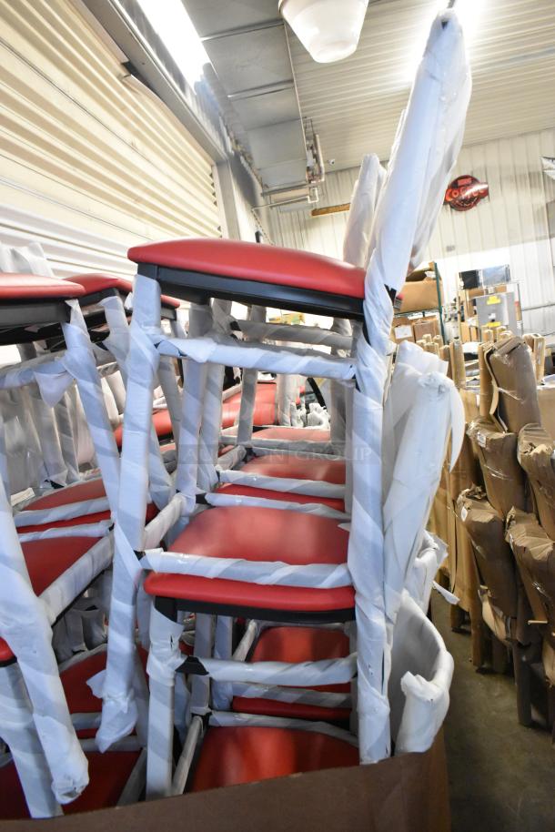 18 new Lancaster black ladder bar chairs with red cushions, wrapped for protection. Scratch and dent condition.