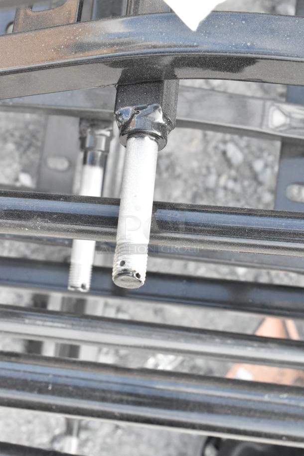 8 new 475AG108FRME frames for 1 cubic yard tilt trucks, 1250 lbs capacity, visible scratch and dent, metal rods with threads.