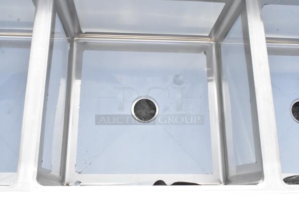 Regency 600S42424224 stainless steel 4-bay sink with dual drain boards, no legs, scratch and dent condition, brand new.