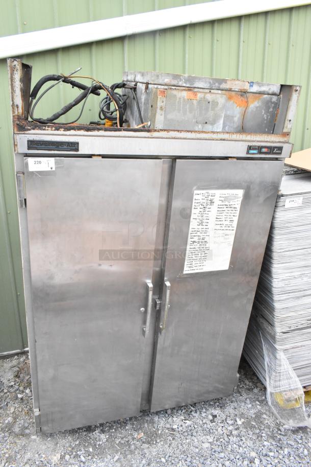 Beverage Air stainless steel commercial 2-door reach-in freezer. Visible wear and rust on top. Brand label intact.
