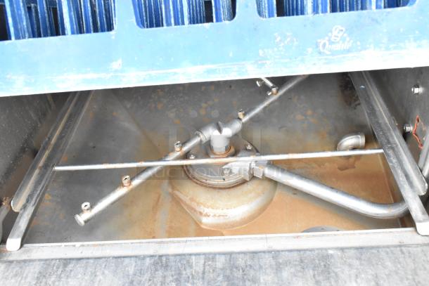 Auto-Chlor AC stainless steel commercial dishwasher, front load, 115 volts, 1 phase, interior spray arms visible, used condition.