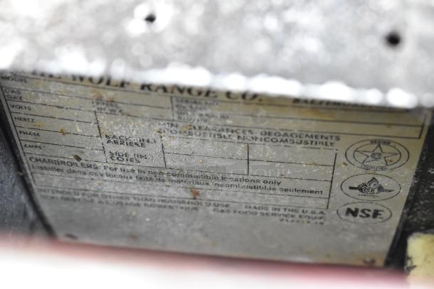 Wolf Stainless Steel Commercial Griddle label, showing gas type, clearance requirements, and NSF certification logo.