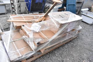 Bundle of 5 scratch-and-dent items including Lancaster 17-gallon trash can and green epoxy shelf, wrapped on pallet.