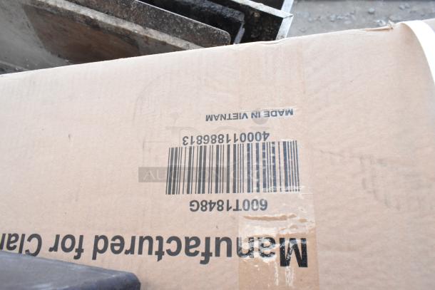 Cardboard box with visible barcode and "Made in Vietnam" text; part of auction lot including industrial kitchen items.