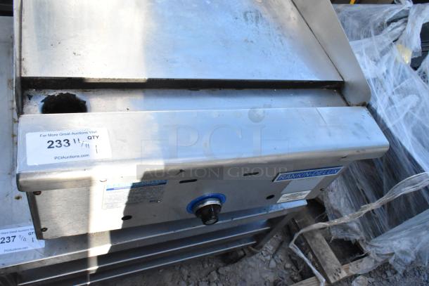 Rankin-Delux 24-C stainless steel countertop griddle, natural gas powered, commercial use, minor wear, visible model label.