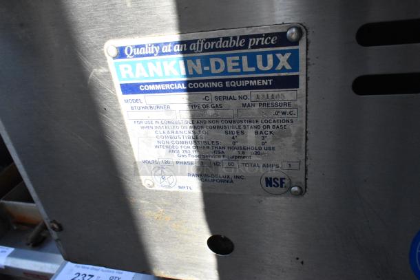 Rankin-Delux 24-C stainless steel gas griddle, NSF certified, serial #131105. Industrial-grade with model and safety tag shown.