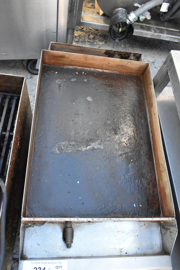 Star 613 stainless steel countertop gas-powered flat top griddle, showing wear and signs of use, suitable for commercial kitchens.