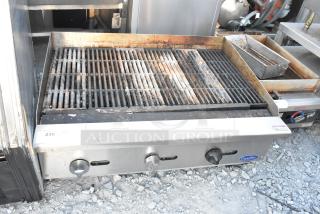 Cook Rite stainless steel commercial countertop gas charbroiler grill, used condition, visible wear, control knobs intact.