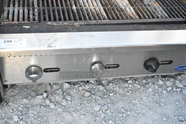 Cook Rite stainless steel commercial countertop gas charbroiler grill with three control knobs, moderate wear, model tag visible.