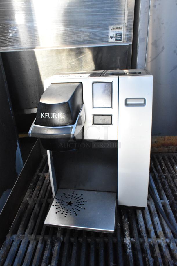 Keurig single cup coffee machine, 120 volts, countertop model, moderate wear, dual bid offer.