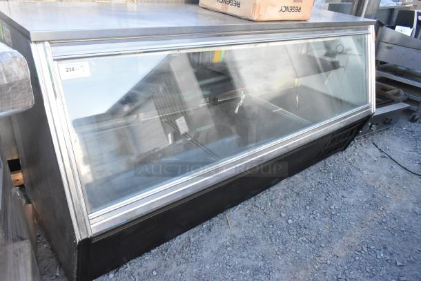 Metal commercial refrigerated deli display case, glass front, metal shelves, good condition, tag marked "238".