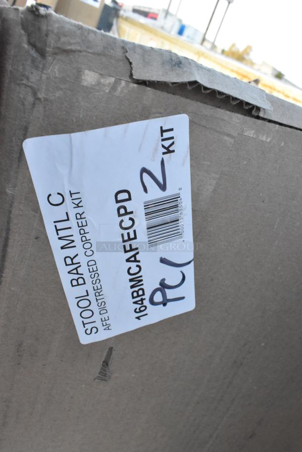Cardboard box with label reading "STOOL BAR MTL C, DISTRESSED COPPER KIT, 164BMC AFE CPD 2 KIT" and barcode.