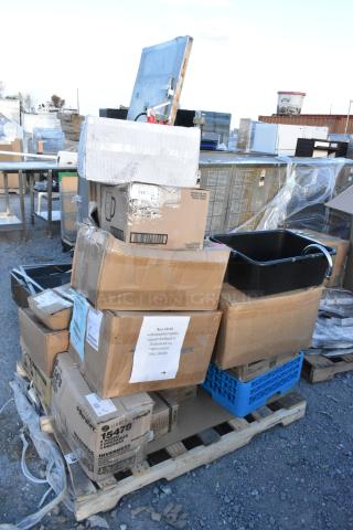 Pallet with 20 scratch and dent items including boxes of glasses and drop-in bins, some labeled as fragile.