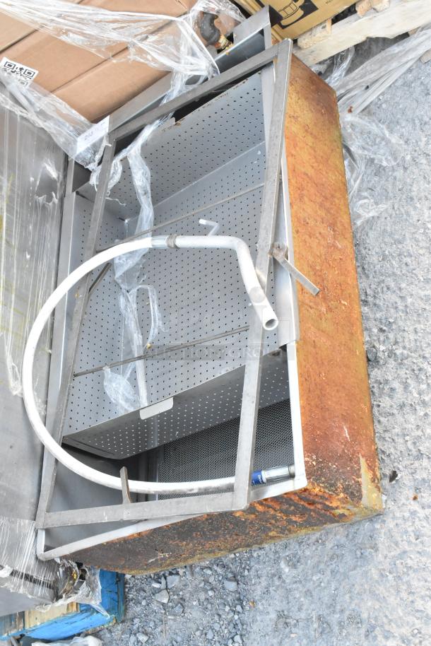 Giles EOF-24 stainless steel 3-bay deep fat fryer with dumping station on casters. Shows wear and rust on exterior.