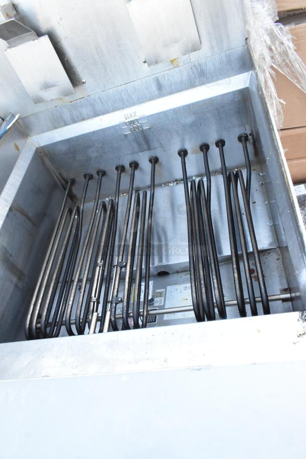 Giles EOF-24 stainless steel 3-bay deep fat fryer, electric powered, with dumping station, on commercial casters.