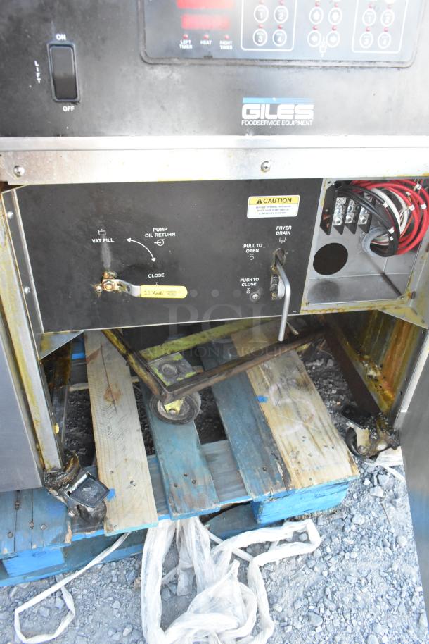 Giles EOF-24 stainless steel 3-bay deep fat fryer with dumping station on casters. 480V, 3-phase. Features control panel and caution label.