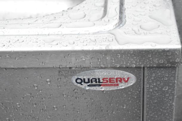 QualServ stainless steel portable sink with commercial casters, water droplets on surface, QualServ logo visible.