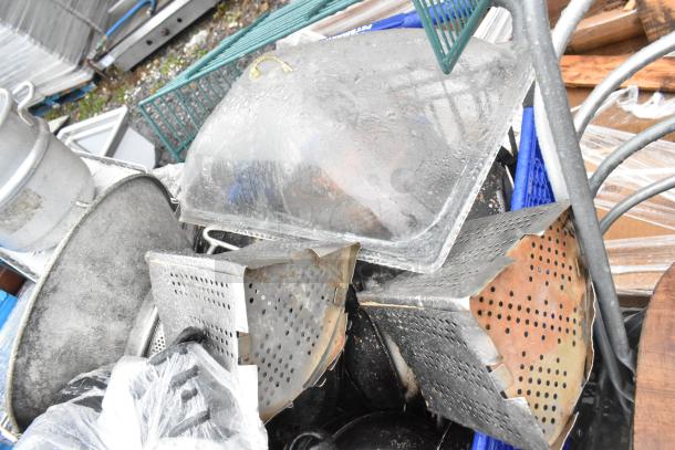 Lot of kitchen items includes potato ricer, metal skillets, baskets. Used condition. No shopping cart included.