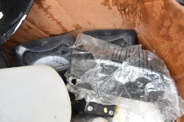 Lot of various items including a plastic bin and napkin dispenser, condition used, visible wear and stains on surfaces.