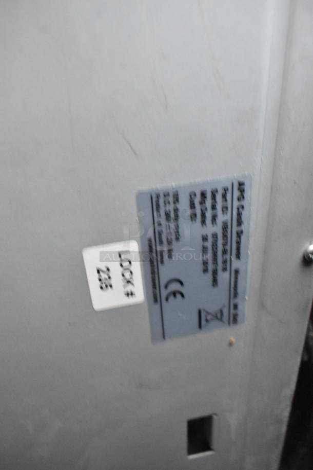 Image showing an Elson receipt printer with visible label, model ESEP521-201, part and serial numbers. Marked with lock# 225.