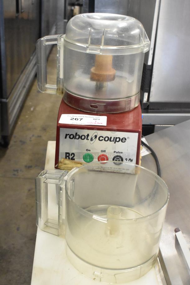 Robot Coupe R2NCLR countertop food processor with bowl and S blade. 120 volts, 1 phase. Moderate wear, label visible.