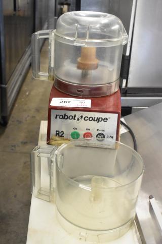 Robot Coupe R2NCLR countertop food processor with bowl and S blade. 120 volts, 1 phase. Moderate wear, label visible.