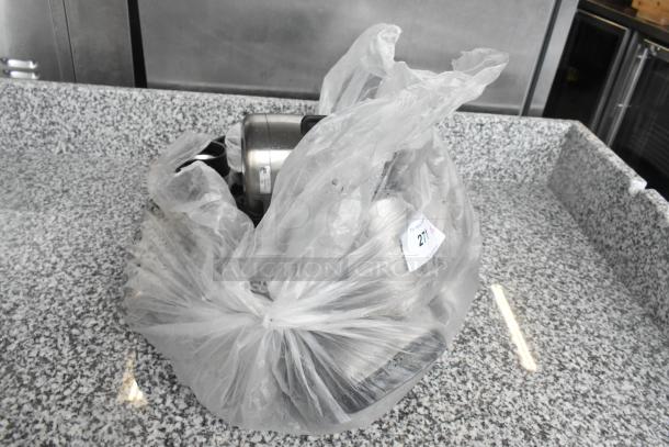 Plastic-wrapped bundle of 15 various metal pitchers, visible through the transparent wrapper. Item tag reads "271."